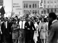 Martin Luther King leading a protest. 